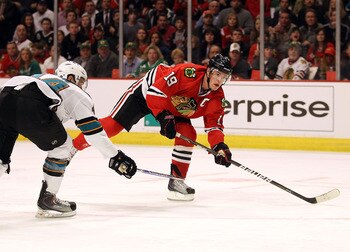 CHICAGO, IL - MARCH 14: Jonathan Toews #19 of the Chicago Blackhawks shoots the puck for a goal in the 2nd period past Marc-Edouard Viasic #44 of the San Jose Sharks at the United Center on March 14, 2011 in Chicago, Illinois. The Blackhawks defeated the