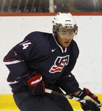 LAKE PLACID, NY - AUGUST 10:  Emerson Etem #14 of Team USA skates against Team Sweden at the Lake Placid Olympic Center on August 10, 2011 in Lake Placid, New York.  (Photo by Bruce Bennett/Getty Images)