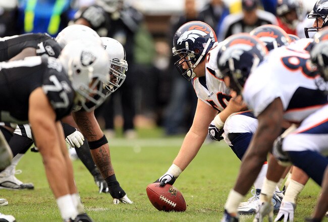 OAKLAND, CA - DECEMBER 19:  J.D. Walton #50 of the Denver Broncos lines up against the Oakland Raiders at Oakland-Alameda County Coliseum on December 19, 2010 in Oakland, California.  (Photo by Ezra Shaw/Getty Images)