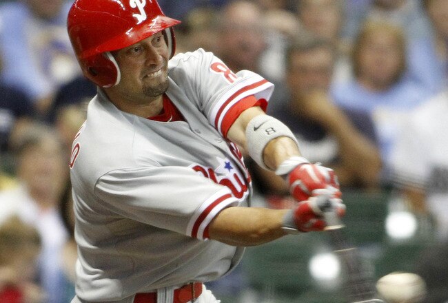 MILWAUKEE, WI - SEPTEMBER 8:  Placido Polanco #27 of the Philadelphia Phillies hits a double against the Milwaukee Brewers during their game against the  at Miller Park on September 8, 2011 in Milwaukee, Wisconsin. (Photo by Mark Hirsch/Getty Images)