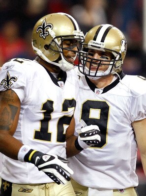 ATLANTA - DECEMBER 13:  Marques Colston #12 and quarterback Drew Brees #9 of the New Orleans Saints celebrate Colston's 3-yard touchdown reception in the second quarter against the Atlanta Falcons at Georgia Dome on December 13, 2009 in Atlanta, Georgia.