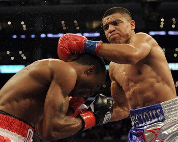LOS ANGELES, CA - SEPTEMBER 18:  Victor Ortiz punches Vivian Harris during the second round in a Welterweight fight at Staples Center on September 18, 2010 in Los Angeles, California. Ortiz would win the fight in a third round knockout.  (Photo by Harry H
