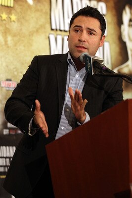 LAS VEGAS - DECEMBER 11:  Golden Boy Promotions President Oscar De La Hoya answers questions during the post-fight news conference after Amir Khan's unanimous decision victory against Marcos Maidana of Argentina after their WBA super lightweight title fig