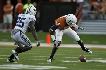 AUSTIN, TX - SEPTEMBER 10:  Wide receiver Darius White #4 of the Texas Longhorns fumbles a second quarter pass as defensive back Corby Eason #25 of the BYU Cougars comes in to tackle on September 10, 2011 at Darrell K. Royal-Texas Memorial Stadium in Aust