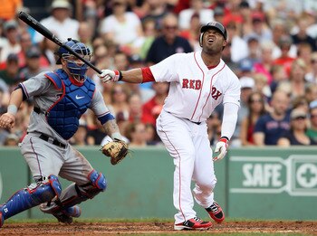 BOSTON, MA - SEPTEMBER 04:  Carl Crawford #13 of the Boston Red Sox reacts after striking out in the second inning as Mike Napoli #25 of the Texas Rangers catches on September 4, 2011 at Fenway Park in Boston, Massachusetts.  (Photo by Elsa/Getty Images)