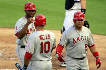 MIAMI GARDENS, FL - JUNE 22:  Bobby Abreu #53 of the Los Angelas Angels of Anaheim celebrates a home run with teammates Tori Hunter #48 and Vernon Wells #10 against the Florida Marlins at Sun Life Stadium on June 22, 2011 in Miami Gardens, Florida.  (Phot