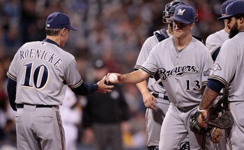 PITTSBURGH - AUGUST 22:  Zach Greinke #13 of the Milwaukee Brewers is pulled from the game against the Pittsburgh Pirates by manager Ron Roenicke #10 during the game on August 2, 2011 at PNC Park in Pittsburgh, Pennsylvania.  (Photo by Jared Wickerham/Get