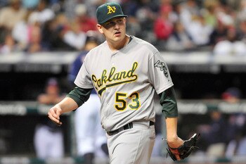 CLEVELAND, OH - AUGUST 30: Starting pitcher Trevor Cahill #53 of the Oakland Athletics looks to the scoreboard as he walks off the field after giving up a two run home run during the sixth inning against the Cleveland Indians at Progressive Field on Augus