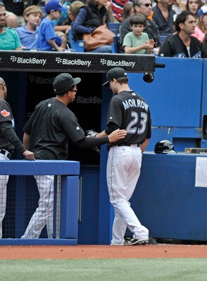 TORONTO, CANADA - AUGUST 28:  Henderson Alvarez #37 of the Toronto Blue Jays meets teammate Brandon Morrow #23 as he walks off the field during MLB game action the Tampa Bay Rays August 28, 2011 at Rogers Centre in Toronto, Ontario, Canada. (Photo by Brad