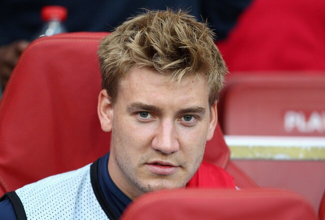 LONDON, ENGLAND - AUGUST 16:  Nicklas Bendtner of Arsenal looks on from the bench ahead of the UEFA Champions League play-off first leg match between Arsenal and Udinese at the Emirates Stadium on August 16, 2011 in London, England.  (Photo by Julian Finn