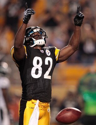 PITTSBURGH - AUGUST 18: Jerricho Cotchery #82 of the Pittsburgh Steelers celebrates after scoring a touchdown against the Philadelphia Eagles in the first half during the preseason game on August 18, 2011 at Heinz Field in Pittsburgh, Pennsylvania.  (Phot