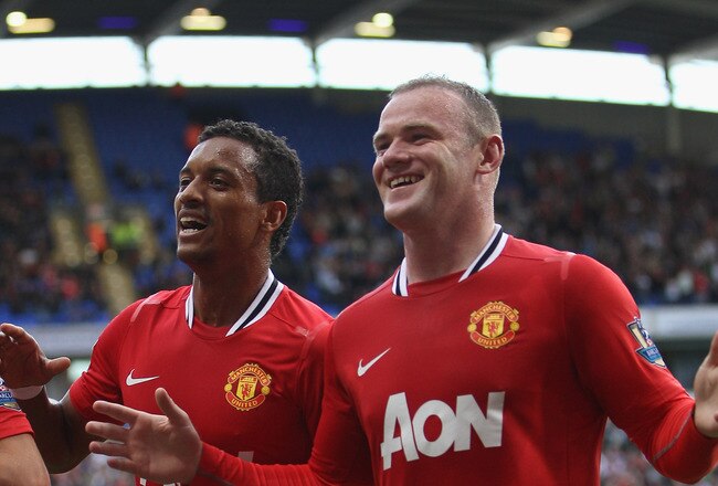 BOLTON, ENGLAND - SEPTEMBER 10: Wayne Rooney (R) of Manchester United celebrates scoring his sides third goal alongside Nani (L) during the Barclays Premier League at the Reebok Stadium on September 10, 2011 in Bolton, England.  (Photo by Michael Steele/G