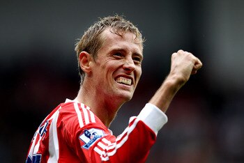 STOKE ON TRENT, ENGLAND - SEPTEMBER 10: Peter Crouch of Stoke celebrates their victory after the Barclays Premier League match between Stoke City and Liverpool at Britannia Stadium on September 10, 2011 in Stoke on Trent, England.  (Photo by Scott Heavey/