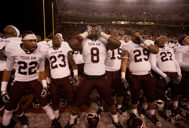 AUSTIN, TX - NOVEMBER 25:  Texas A&M players (L-R) Dustin Harris #22, Ben Malena #23, Jeff Fuller #8, Michael Lamothe #19, Blane Cheatham #29, and C.J. Jones #27 celebrate Texas A&M's 24-17 win over the University of Texas at Darrell K. Royal-Texas Memori