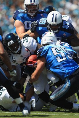 JACKSONVILLE, FL - SEPTEMBER 11:  Maurice Jones-Drew #32 of the Jacksonville Jaguars runs with the ball during their season opener against Akeem Ayers #56 of the Tennessee Titans at EverBank Field on September 11, 2011 in Jacksonville, Florida.  (Photo by