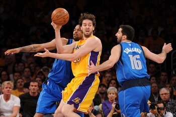 LOS ANGELES, CA - MAY 02:  Pau Gasol #16 of the Los Angeles Lakers passes the ball as he is double-teammed by Tyson Chandler #6 and Peja Stojakovic #16 of the Dallas Mavericks in Game One of the Western Conference Semifinals in the 2011 NBA Playoffs at St
