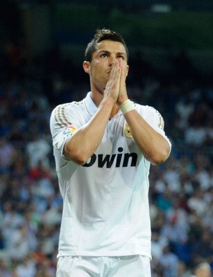 MADRID, SPAIN - SEPTEMBER 10:  Cristiano Ronaldo of Real Madrid reacts after his shot went wide of target  during the La Liga match bewteen Real Madrid and Getafe at Estadio Santiago Bernabeu on September 10, 2011 in Madrid, Spain.  (Photo by Denis Doyle/