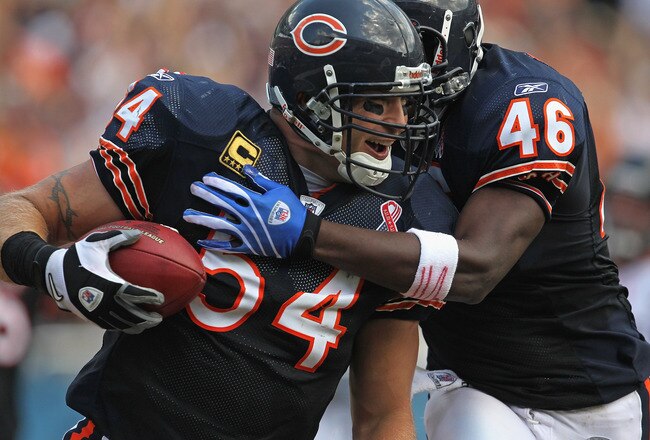 CHICAGO, IL - SEPTEMBER 11:  Brian Urlacher #54 and Chris Harris #46 of the Chicago Bears celebrate Urlacher's touchdown run against the Atlanta Falcons at Soldier Field on September 11, 2011 in Chicago, Illinois. The Bears defeated the Falcons 30-12.  (P