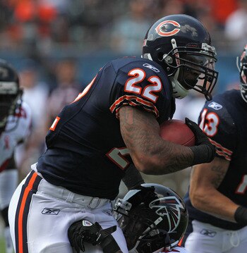 CHICAGO, IL - SEPTEMBER 11: Matt Forte #22 of the Chicago Bears is hit by Thomas DeCoud #28 of the Atlanta Falcons at Soldier Field on September 11, 2011 in Chicago, Illinois.The Bears defeated the Falcons 30-12. (Photo by Jonathan Daniel/Getty Images)