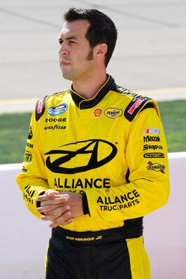 NEWTON, IA - AUGUST 6:  Sam Hornish Jr., driver of the #22 Discount Tire Dodge, stands on the grid during qualifying for the NASCAR Nationwide Series U.S. Cellular 250 at Iowa Speedway on August 6, 2011 in Newton, Iowa. (Photo by Jason Smith/Getty Images
