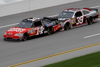 TALLADEGA, AL - APRIL 15:  Tony Stewart, driver of the #14 Office Depot/Mobil 1 Chevrolet, Ryan Newman, driver of the #39 Haas Automation Chevrolet, during practice for the NASCAR Sprint Cup Series Aaron's 499 at Talladega Superspeedway on April 15, 2011