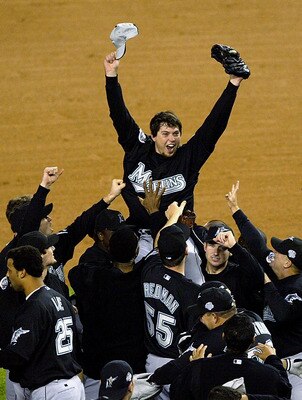 RONX, NY - OCTOBER 25:  The Florida Marlins hoist up pitcher Josh Beckett #21 the 2003 World Series MVP after defeating the New York Yankees 2-0 in game six of the Major League Baseball World Series on October 25, 2003 at Yankee Stadium in the Bronx, New