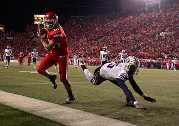 SALT LAKE CITY - NOVEMBER 22:  David Reed #16 of the Utah Utes scores a touchdown against Brendan Bradley #5 of the BYU Cougars at Rice-Eccles Stadium on November 22, 2008 in Salt Lake City, Utah.  (Photo by Jonathan Ferrey/Getty Images)