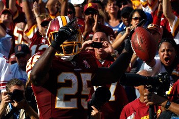 LANDOVER, MD - SEPTEMBER 11:  Running back  Tim Hightower #25 of the Washington Redskins reacts after scoring on a one-yard touchdown run in the second quarter against the New York Giants at FedExField on September 11, 2011 in Landover, Maryland.  (Photo
