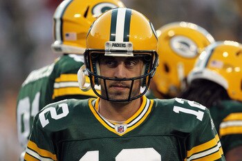 GREEN BAY, WI - SEPTEMBER 08:  Aaron Rodgers #12 of the Green Bay Packers warms up before taking on the New Orleans Saints in the season opening game at Lambeau Field on September 8, 2011 in Green Bay, Wisconsin.  (Photo by Jonathan Daniel/Getty Images)