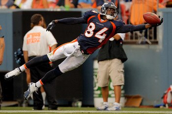 DENVER, CO - AUGUST 20:  Wide receiver Brandon Lloyd #84 of the Denver Broncos lays out but is unable to haul in a pass during the first half against the Buffalo Bills at Sports Authority Field at Mile High on August 20, 2011 in Denver, Colorado. (Photo b