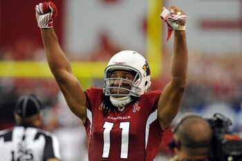 GLENDALE, AZ - SEPTEMBER 11:  Larry Fitzgerald #11 of the Arizona Cardinals celebrates a 28-21 victory against the Carolina Panthers in the NFL season opening game at the University of Phoenix Stadium on September 11, 2011 in Glendale, Arizona.  (Photo by
