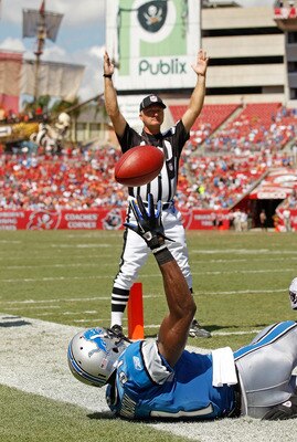 TAMPA, FL - SEPTEMBER 11:  Calvin Johnson #81 of the Detroit Lions scores a touchdown during the season opener against the Tampa Bay Buccaneers at Raymond James Stadium on September 11, 2011 in Tampa, Florida.  (Photo by Mike Ehrmann/Getty Images)