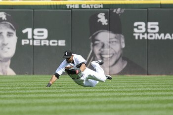 CHICAGO, IL - SEPTEMBER 11: Alex Rios #51 of the Chicago White tries to make a diving catch on Trevor Crowe #4 of the Cleveland Indians in the sixth inning on September 11, 2011 at U.S. Cellular Field in Chicago, Illinois.  (Photo by David Banks/Getty Ima