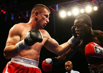NEWARK, NJ - DECEMBER 11:  Tomasz Adamek punches Steve Cunningham  during their IBF Cruiserweight Championship fight on December 11, 2008 at The Prudential Center in Newark, New Jersey.  Tomask won a split decision.  (Photo by Al Bello/Getty Images)