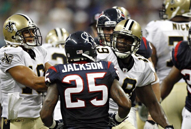 HOUSTON - AUGUST 20:  Cornerback Kareem Jackson #25 of the Houston Texans and Devery Henderson #19 of the New Orleans Saints get into an altercation at Reliant Stadium on August 20, 2011 in Houston, Texas.  (Photo by Bob Levey/Getty Images)