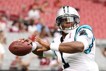 GLENDALE, AZ - SEPTEMBER 11:  Quarterback Cam Newton #1 of the Carolina Panthers warms up before the NFL season opening game against the Arizona Cardinals at the University of Phoenix Stadium on September 11, 2011 in Glendale, Arizona. The Carindals defea