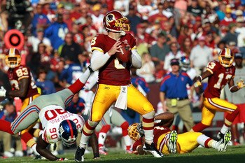 LANDOVER, MD - SEPTEMBER 11:   Rex Grossman #8 of the Washington Redskins drops back to pass against the New York Giants during the season opener at FedExField on September 11, 2011 in Landover, Maryland.  (Photo by Ronald Martinez/Getty Images)