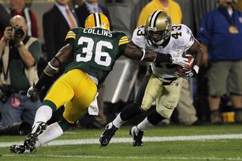 GREEN BAY, WI - SEPTEMBER 08:   Darren Sproles #43 of the New Orleans Saints returns a punt against  M.D. Jennings #43 of the Green Bay Packers during the season opening game at Lambeau Field on September 8, 2011 in Green Bay, Wisconsin.  (Photo by Jonath