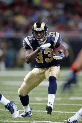 ST. LOUIS, MO - AUGUST 13: Carnell Williams #33 of the St. Louis Rams runs with the ball during the NFL preseason game against the Indianapolis Colts at Edward Jones Dome on August 13, 2011 in St. Louis, Missouri. The Rams defeated the Colts 33-10. (Photo