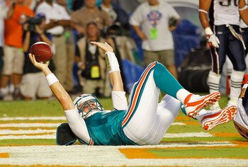 MIAMI GARDENS, FL - SEPTEMBER 12:  Chad Henne #7 of the Miami Dolphins rushes for a touchdown during a game  against the New England Patriots at Sun Life Stadium on September 12, 2011 in Miami Gardens, Florida.  (Photo by Mike Ehrmann/Getty Images)