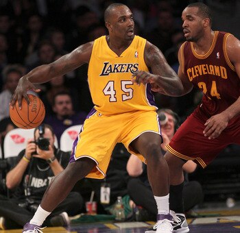 LOS ANGELES, CA - JANUARY 11:   Derrick Caracter #45 of the Los Angeles Lakers controls the ball against Samardo Samuels #24 of the Cleveland Cavaliers at Staples Center on January 11, 2011 in Los Angeles, California.  The Lakers won 112-57.  NOTE TO USER