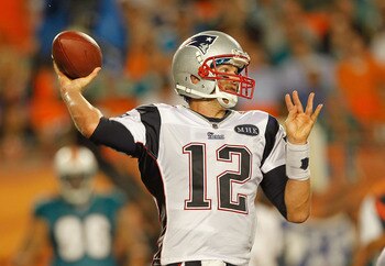 MIAMI GARDENS, FL - SEPTEMBER 12:  Tom Brady #12 of the New England Patriots passes during a game against the Miami Dolphins at Sun Life Stadium on September 12, 2011 in Miami Gardens, Florida.  (Photo by Mike Ehrmann/Getty Images)