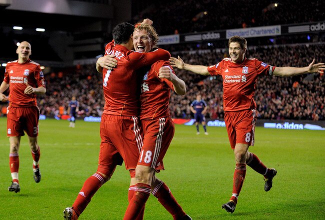 LIVERPOOL, ENGLAND - FEBRUARY 02:  Luis Suarez of Liverpool celebrates with team mates Dirk Kuyt and Steven Gerrard (R) afterscoring his team's second goal during the Barclays Premier League match between Liverpool and Stoke City at Anfield on February 2,