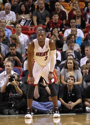 MIAMI - NOVEMBER 17:  Dwyane Wade #3 of the Miami Heat watches a foul shot during a game against the Phoenix Suns at American Airlines Arena on November 17, 2010 in Miami, Florida. NOTE TO USER: User expressly acknowledges and agrees that, by downloading