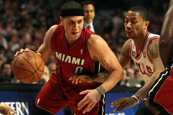 CHICAGO, IL - MAY 26:  Mike Bibby #0 of the Miami Heat drives against Derrick Rose #1 of the Chicago Bulls in Game Five of the Eastern Conference Finals during the 2011 NBA Playoffs on May 26, 2011 at the United Center in Chicago, Illinois. NOTE TO USER: