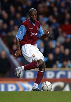 BIRMINGHAM - JANUARY 18:  Ian Taylor of Aston Villa runs with the ball during the FA Barclaycard Premiership match between Aston Villa and Tottenham Hotspur held on January 18, 2003 at Villa Park, in Birmingham, England. Tottenham Hotspur won the match 1-