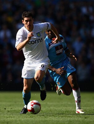 BIRMINGHAM, ENGLAND - APRIL 18:  Gareth Barry (L) of Aston Villa wins the ball over Luis Boa Morte (R) of West Ham during the Barclays Premier League match between Aston Villa and West Ham United at Villa Park on April 18, 2009 in Birmingham, England.  (P