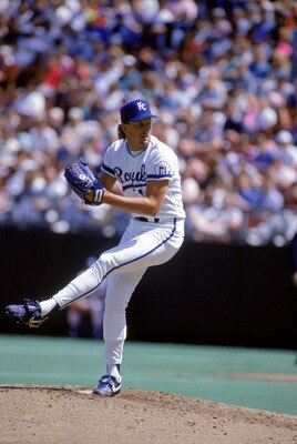 KANSAS CITY, MO - 1990:  Bret Saberhagen #31 of the Kansas City Royals winds up for a pitch during a game in 1990 at Royals Stadium in Kansas City, Missouri.  (Photo by Jonathan Daniel/Getty Images)