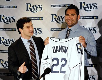 ST PETERSBURG, FL - FEBRUARY 01:  Executive Vice President of Baseball Operations Andrew Friedma (L) poses with Johnny Damon #22 of the Tampa bay Rays during a press conference at Tropicana Field on February 1, 2011 in St Petersburg, Florida.  (Photo by J