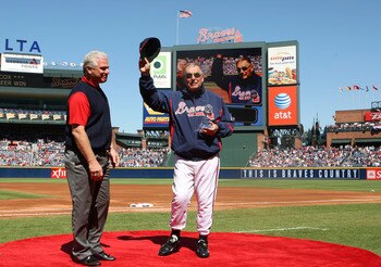 ATLANTA - OCTOBER 3:  Manager Bobby Cox #6 of the Atlanta Braves receives a trophy commenmorating his 2,500th win from general manager Frank Wren (L) before the game against the Philadelphia Phillies at Turner Field on October 3, 2010 in Atlanta, Georgia.